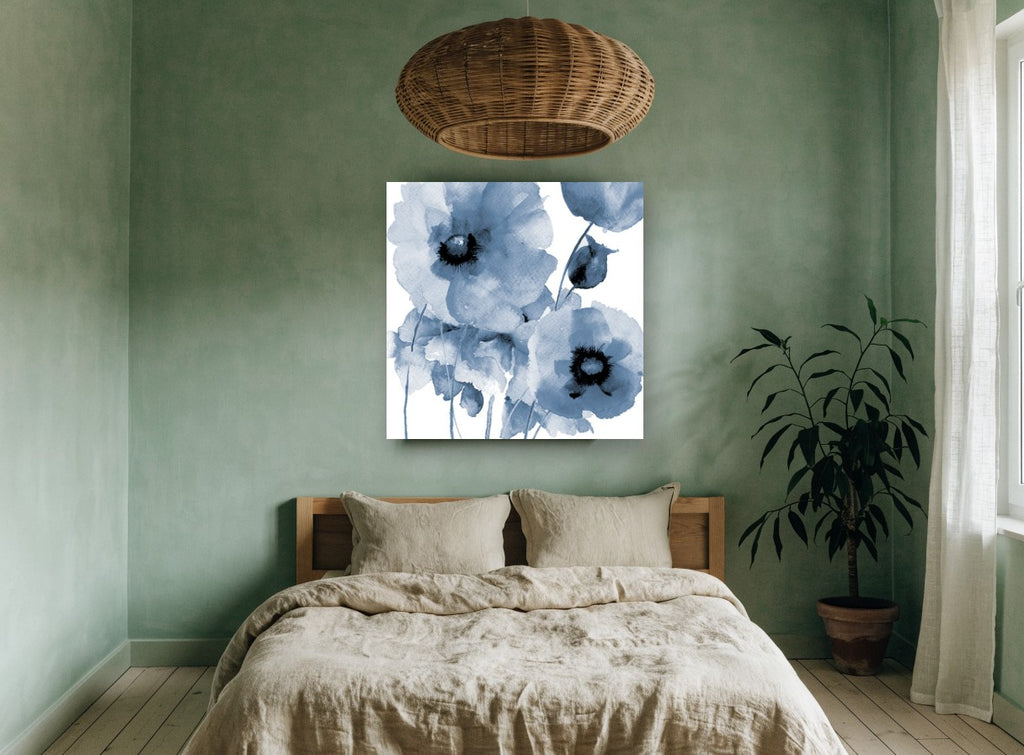 Indigo Poppy Wash floral canvas print on the wall of a bedroom