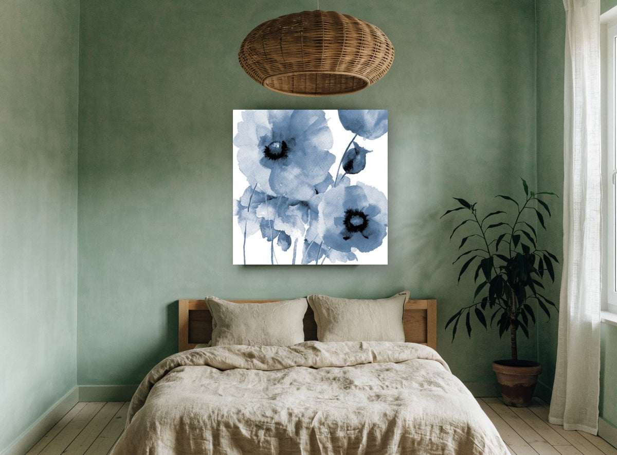 Indigo Poppy Wash floral canvas print on the wall of a bedroom