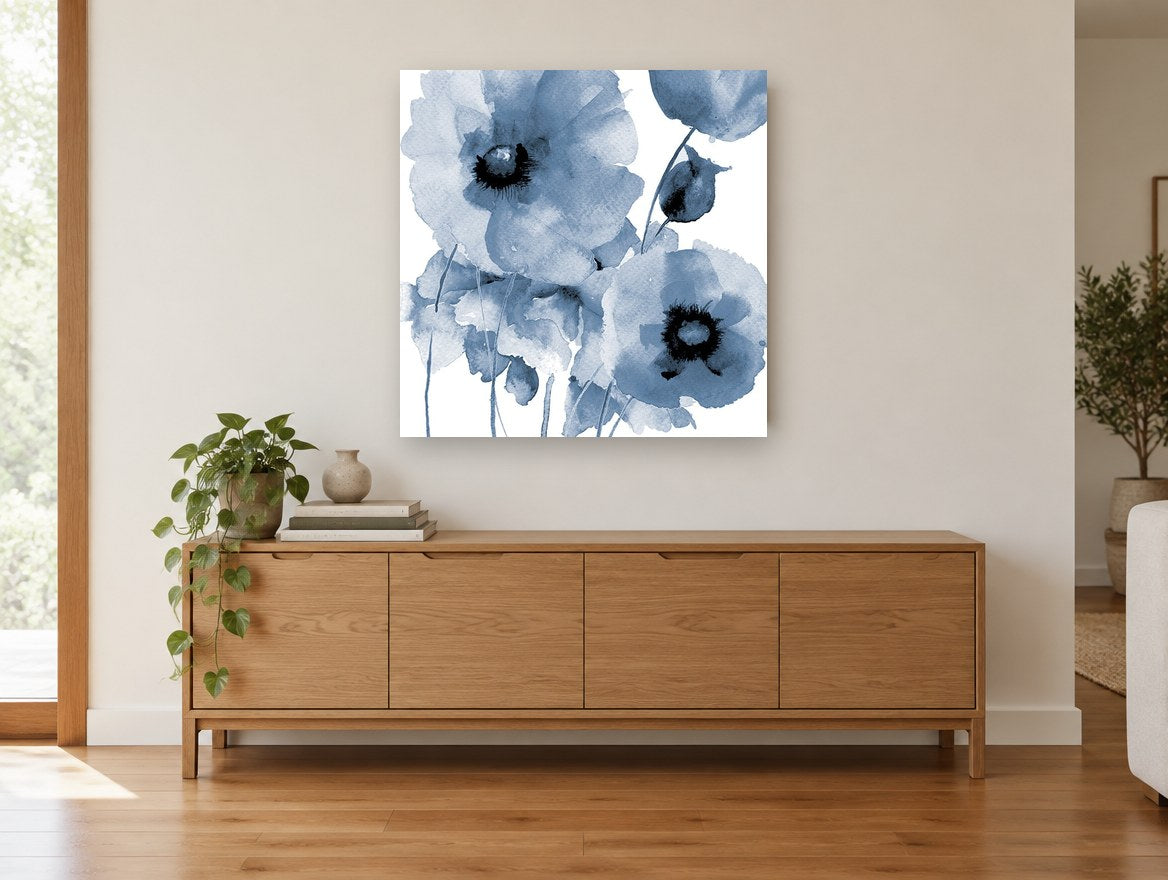 Indigo Poppy Wash floral canvas print on the wall of a living room above a sideboard