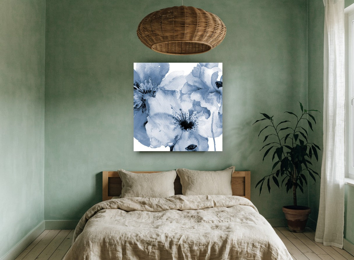 Indigo Poppy Wash floral canvas print on the wall of a bedroom
