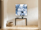 Indigo Poppy Wash floral canvas print on the wall of a hallway