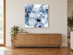 Indigo Poppy Wash floral canvas print on the wall of a living room above a sideboard