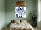 Blue Peony Haze floral canvas print on the wall of a bedroom
