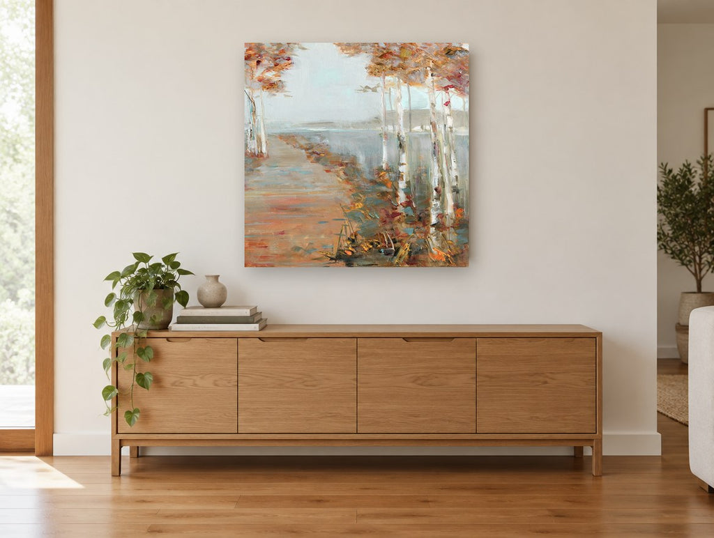 Birch Path Haze landscape canvas print on the wall of a living room above a sideboard