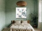 Blue Blossom Drift floral canvas print on the wall of a bedroom