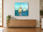 Two Sails Teal Calm coastal canvas print on the wall of a living room above a sideboard