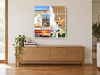 Summer Beach Montage coastal canvas print on the wall of a living room above a sideboard