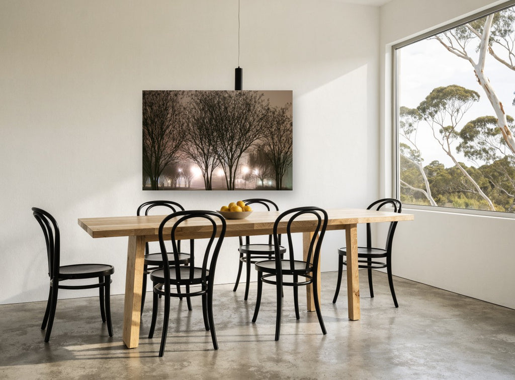 Lamplit Winter Trees landscape canvas print on the wall of a dining room