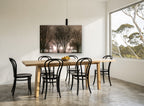 Lamplit Winter Trees landscape canvas print on the wall of a dining room
