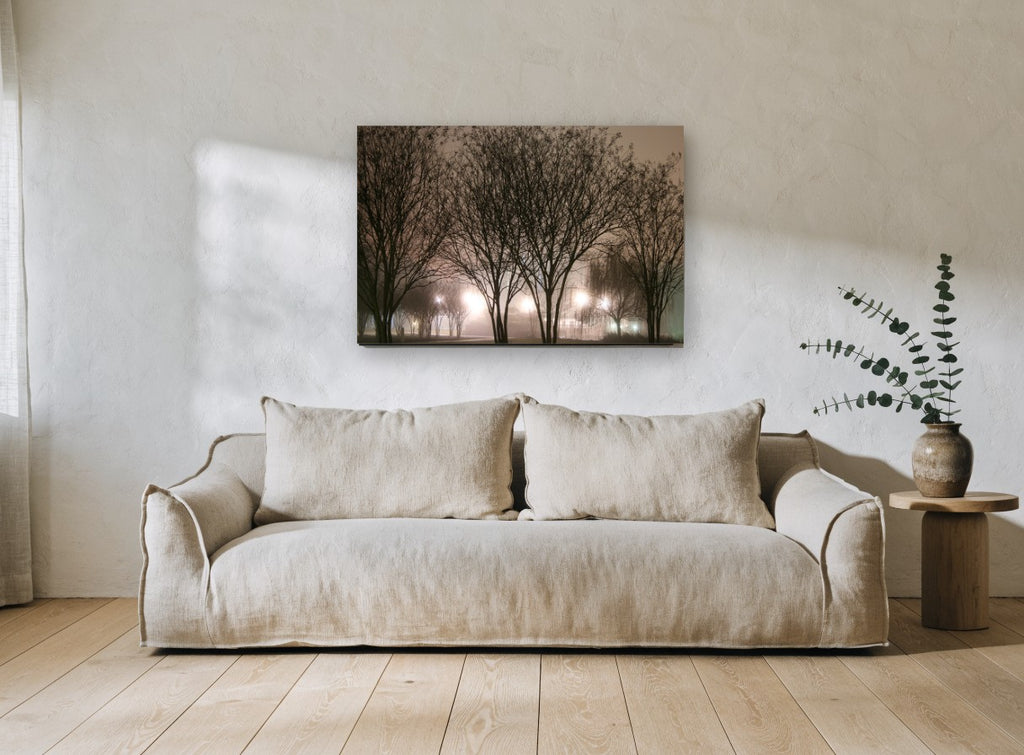 Lamplit Winter Trees landscape canvas print on the wall of a living room