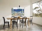 Porch Chairs and Sail coastal canvas print on the wall of a dining room