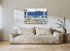 Porch Chairs and Sail coastal canvas print on the wall of a living room