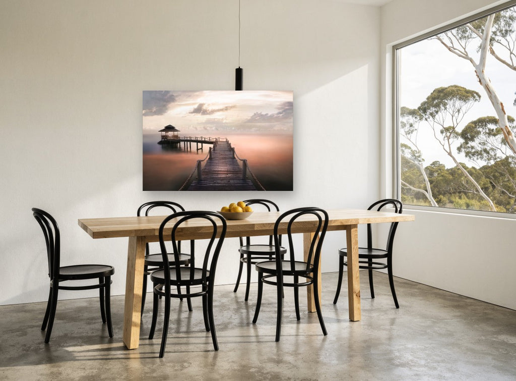 Dawn Jetty Calm coastal canvas print on the wall of a dining room