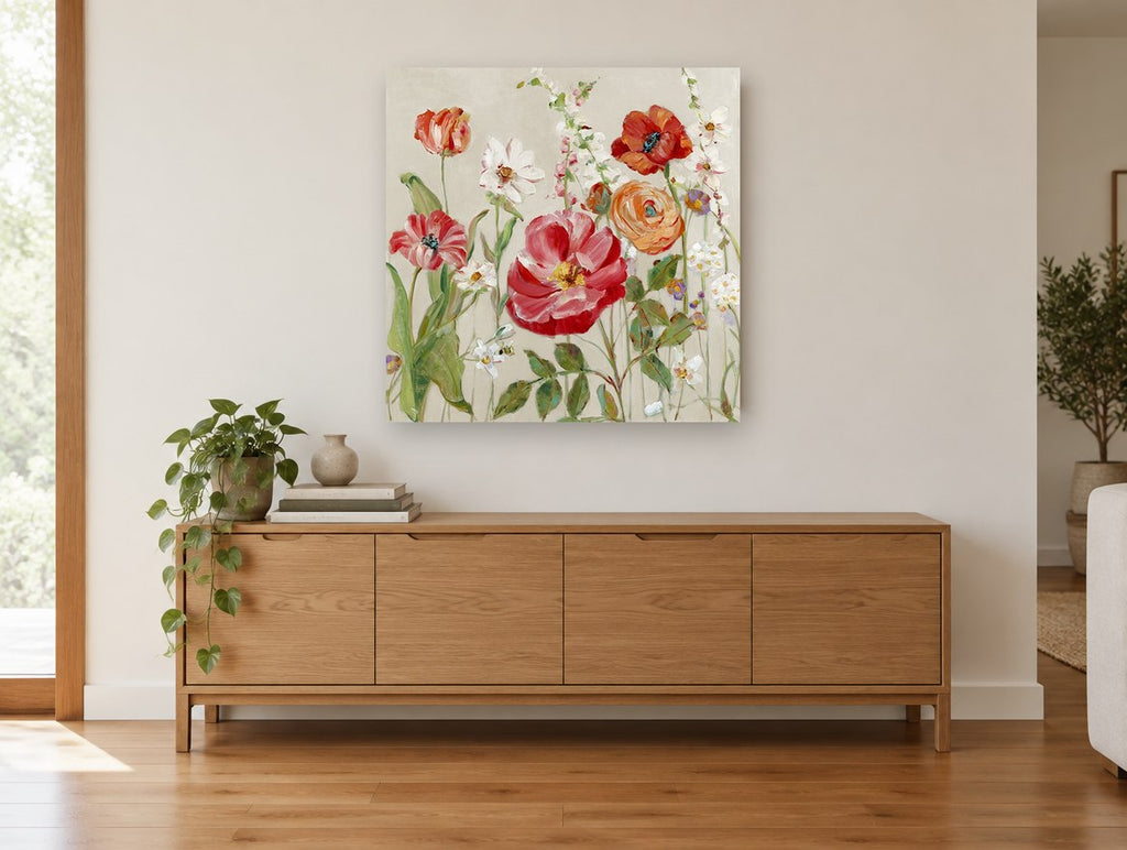 Red Poppies and Ranunculus floral canvas print on the wall of a living room above a sideboard