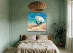 Shaded Chairs by the Shore coastal canvas print on the wall of a bedroom