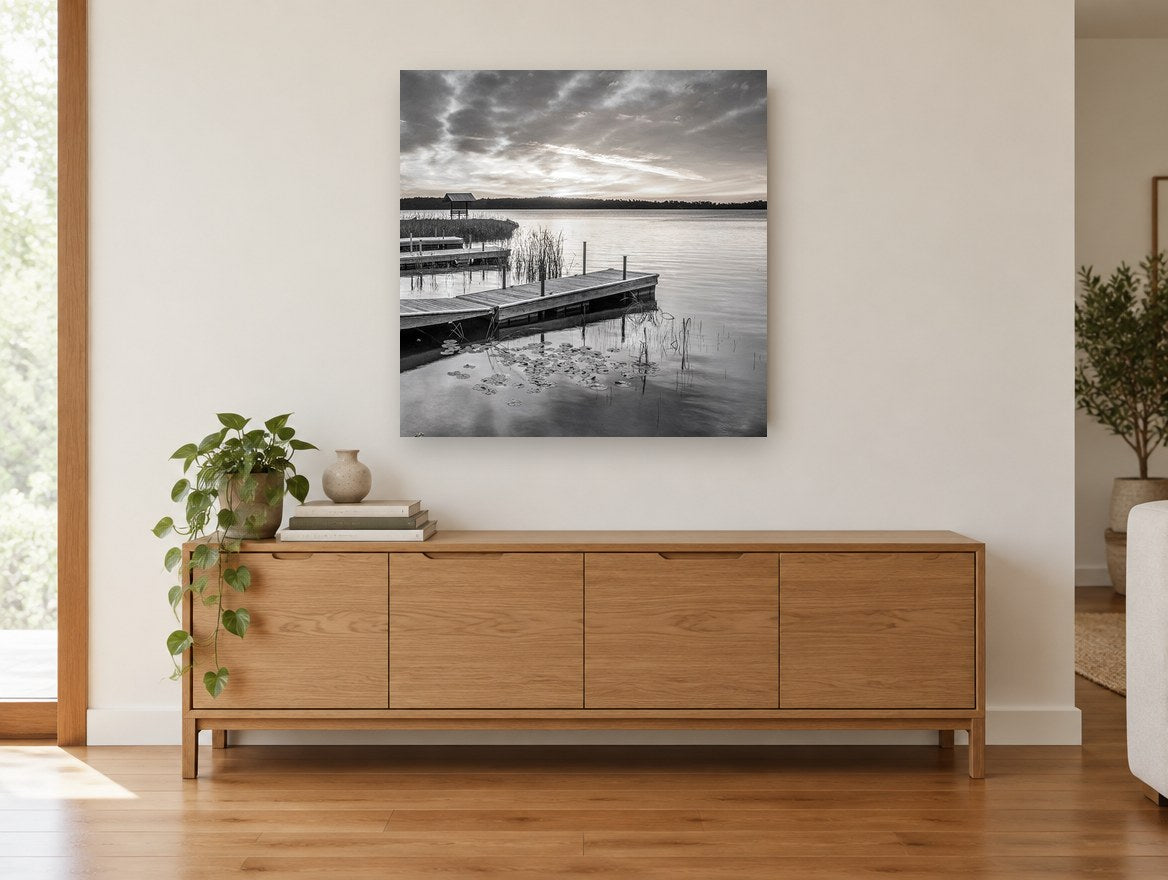Quiet Dock Dawn landscape canvas print on the wall of a living room above a sideboard