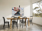 Blooming Profile Collage floral canvas print on the wall of a dining room