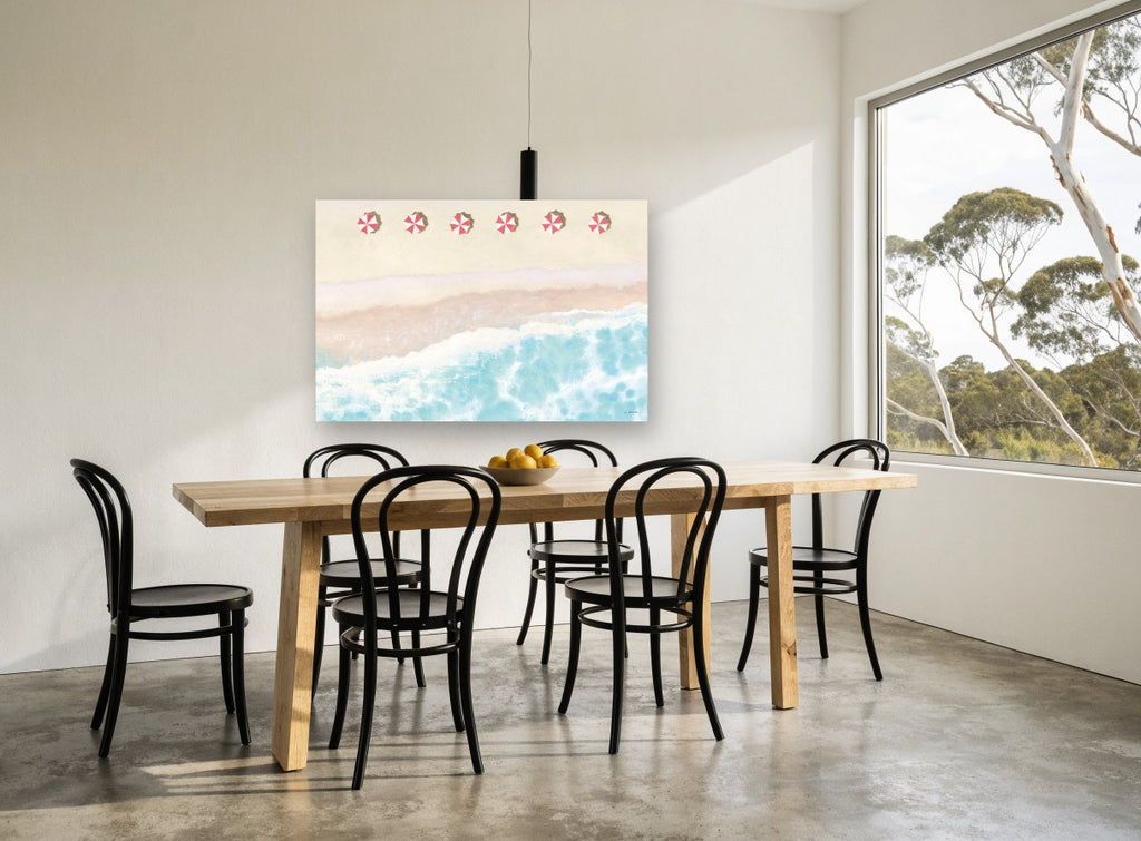 Six Red Umbrellas Aerial coastal canvas print on the wall of a dining room