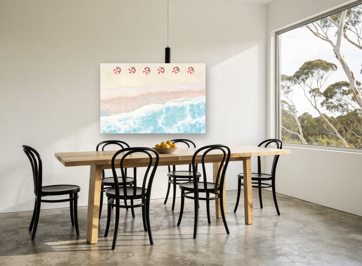Six Red Umbrellas Aerial coastal canvas print on the wall of a dining room