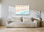 Six Red Umbrellas Aerial coastal canvas print on the wall of a living room