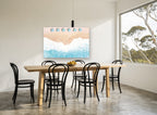 Pink Sand Umbrella Row coastal canvas print on the wall of a dining room