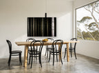 Dark Spruce Columns landscape canvas print on the wall of a dining room
