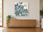 Slate Leaf Silhouettes floral canvas print on the wall of a living room above a sideboard