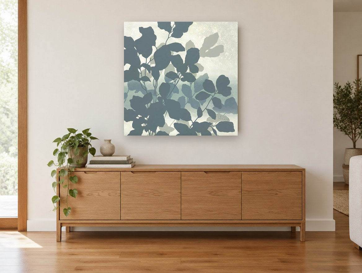 Slate Leaf Silhouettes floral canvas print on the wall of a living room above a sideboard