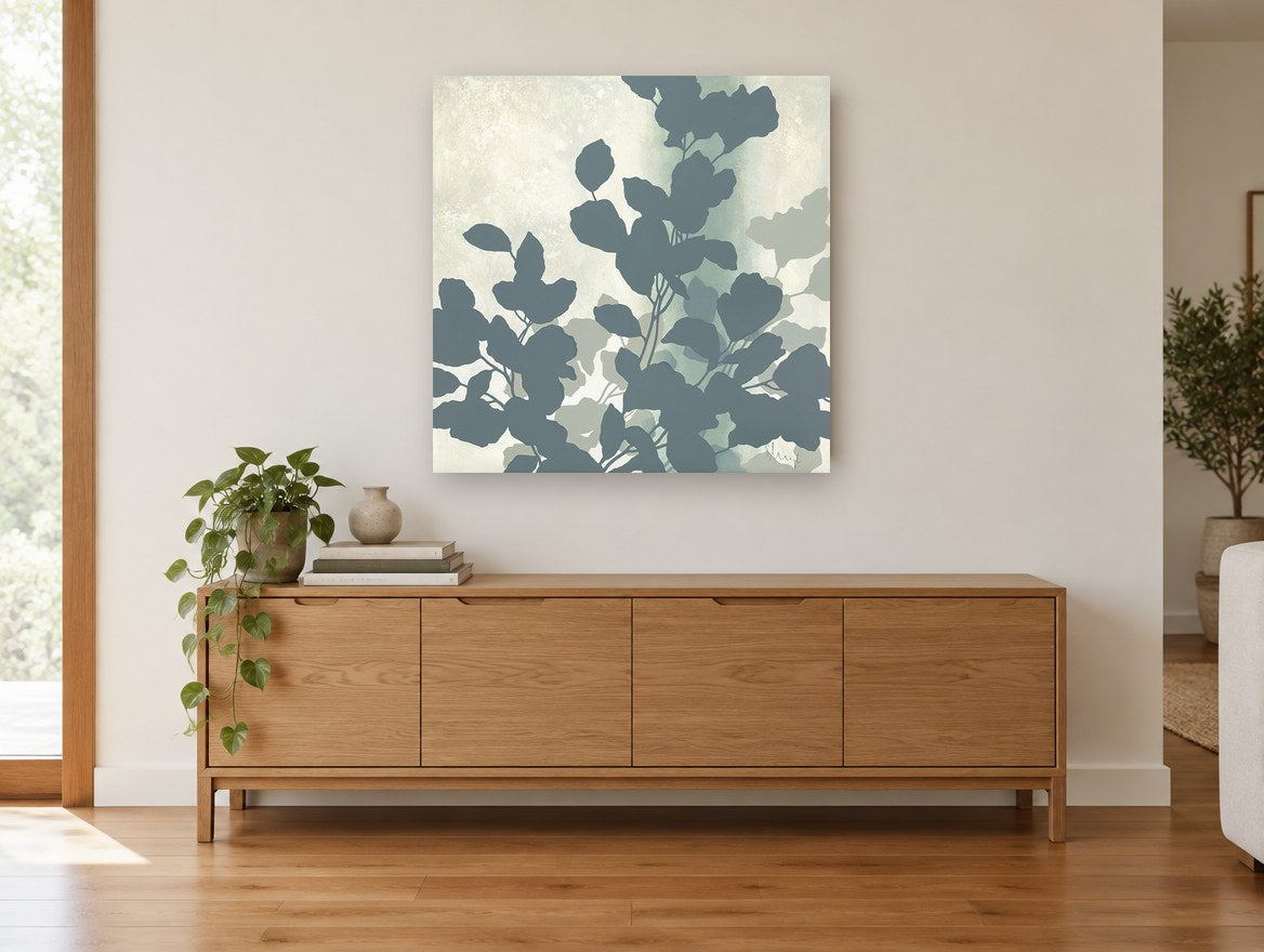 Slate Leaf Silhouettes floral canvas print on the wall of a living room above a sideboard