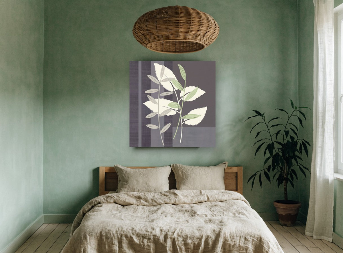Sage and Cream Leaves floral canvas print on the wall of a bedroom