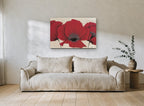 Three Red Poppies floral canvas print on the wall of a living room