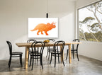 Orange Geo Triceratops animal canvas print on the wall of a dining room