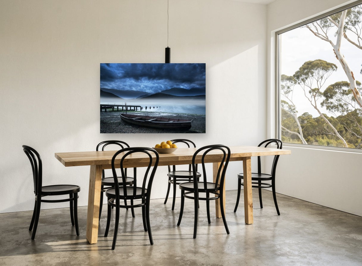 Misty Lake Rowboat coastal canvas print on the wall of a dining room