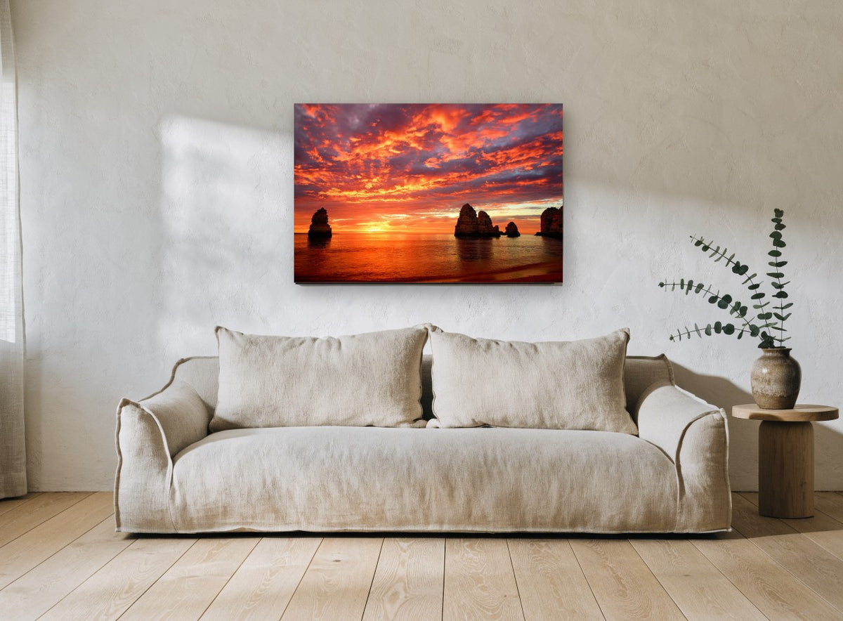 Ember Sky Sea Stacks coastal canvas print on the wall of a living room