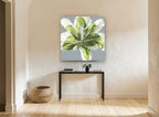 Green Lily Bloom floral canvas print on the wall of a hallway
