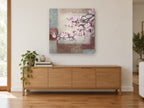 Blossom Branch Patchwork floral canvas print on the wall of a living room above a sideboard