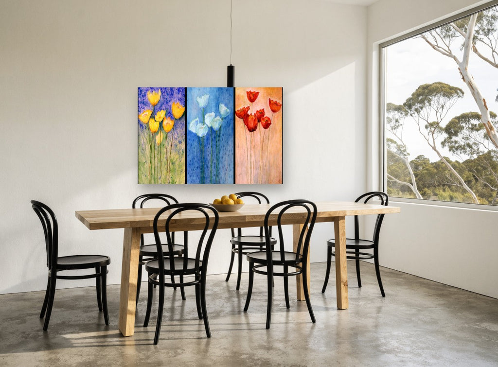 Three Panel Tulip Trio floral canvas print on the wall of a dining room
