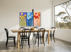 Three Panel Tulip Trio floral canvas print on the wall of a dining room