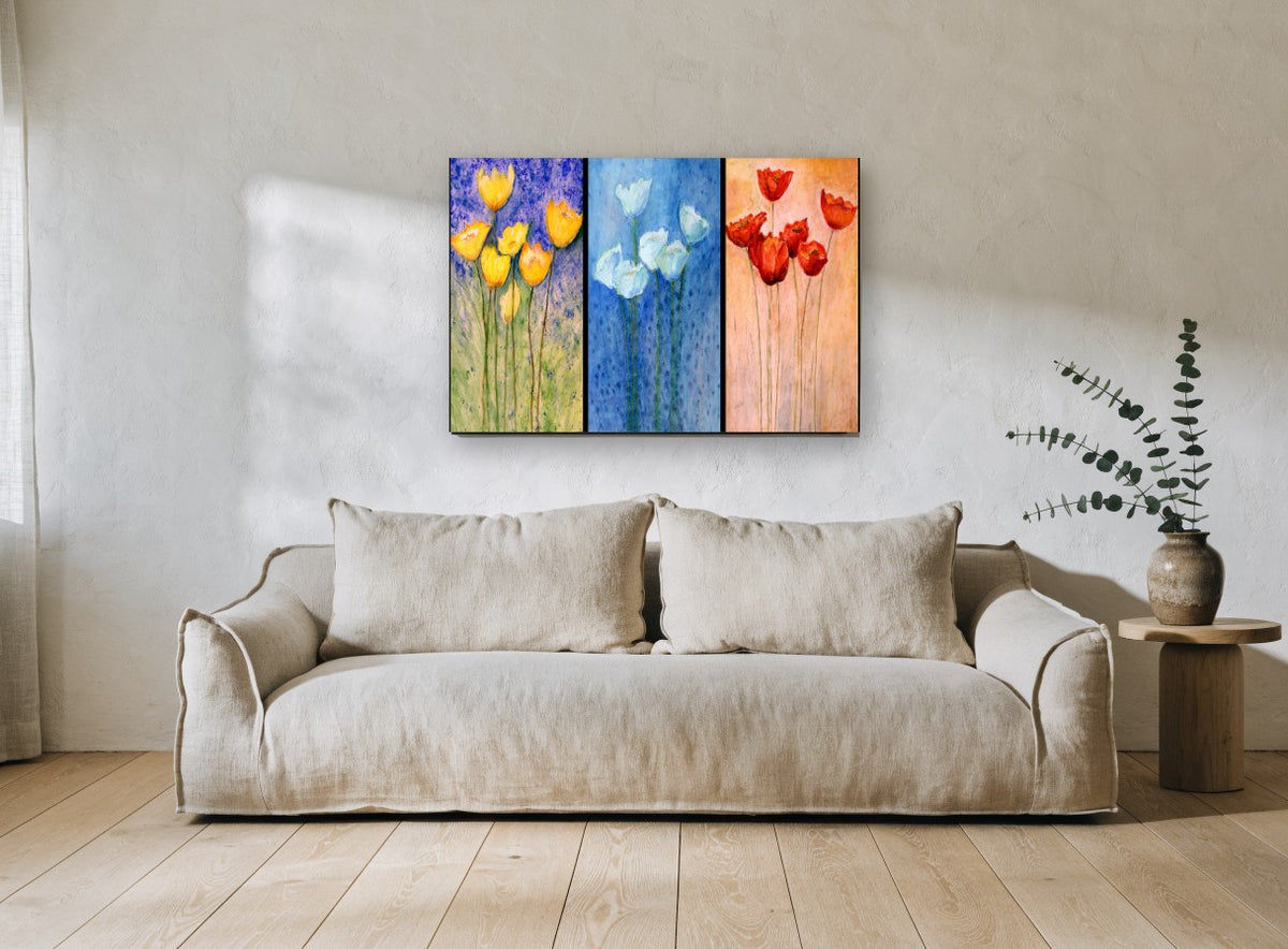 Three Panel Tulip Trio floral canvas print on the wall of a living room