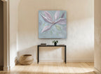 Dusky Magnolia Bloom floral canvas print on the wall of a hallway