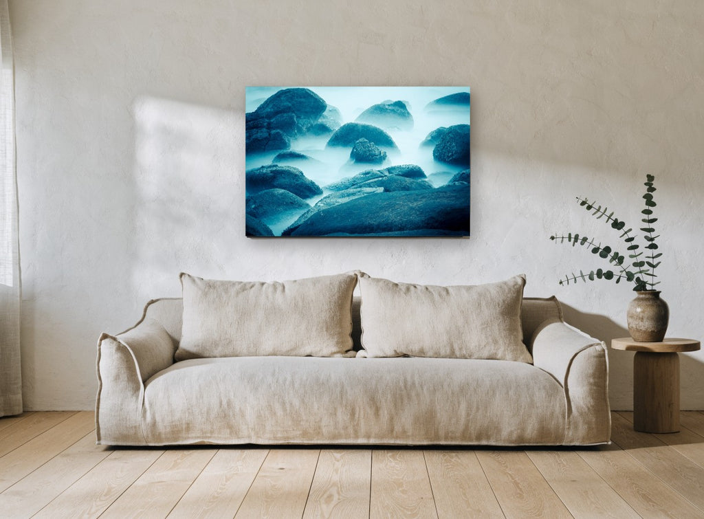 Blue Mist Boulders coastal canvas print on the wall of a living room