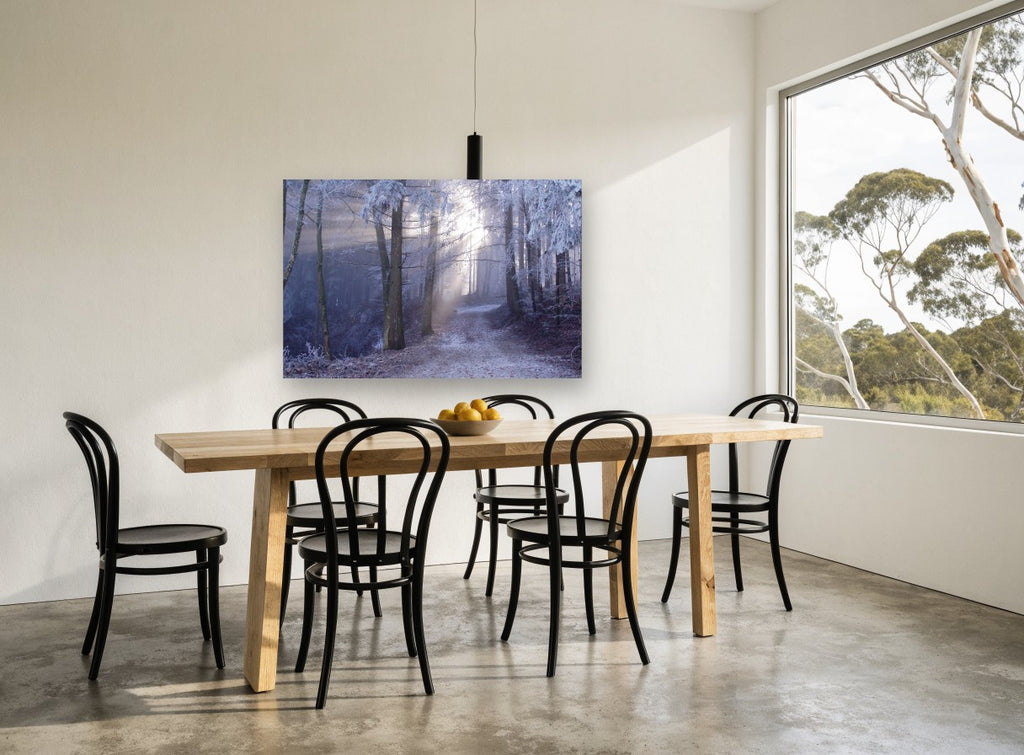 Frosted Forest Light landscape canvas print on the wall of a dining room