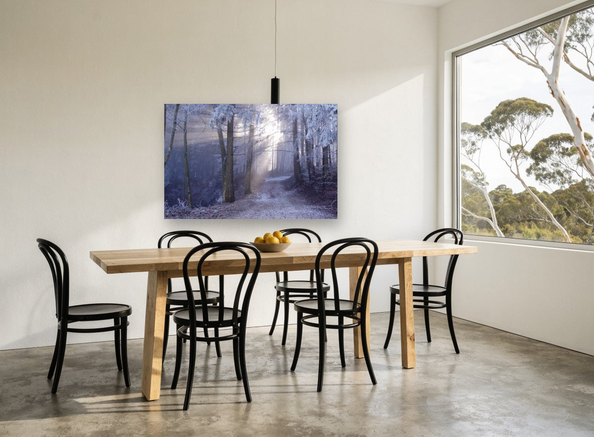 Frosted Forest Light landscape canvas print on the wall of a dining room