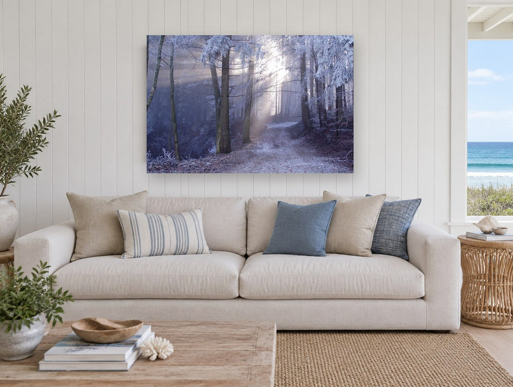 Frosted Forest Light landscape canvas print on the wall of a beach house living room