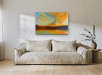 Amber Cloud Shoreline coastal canvas print on the wall of a living room