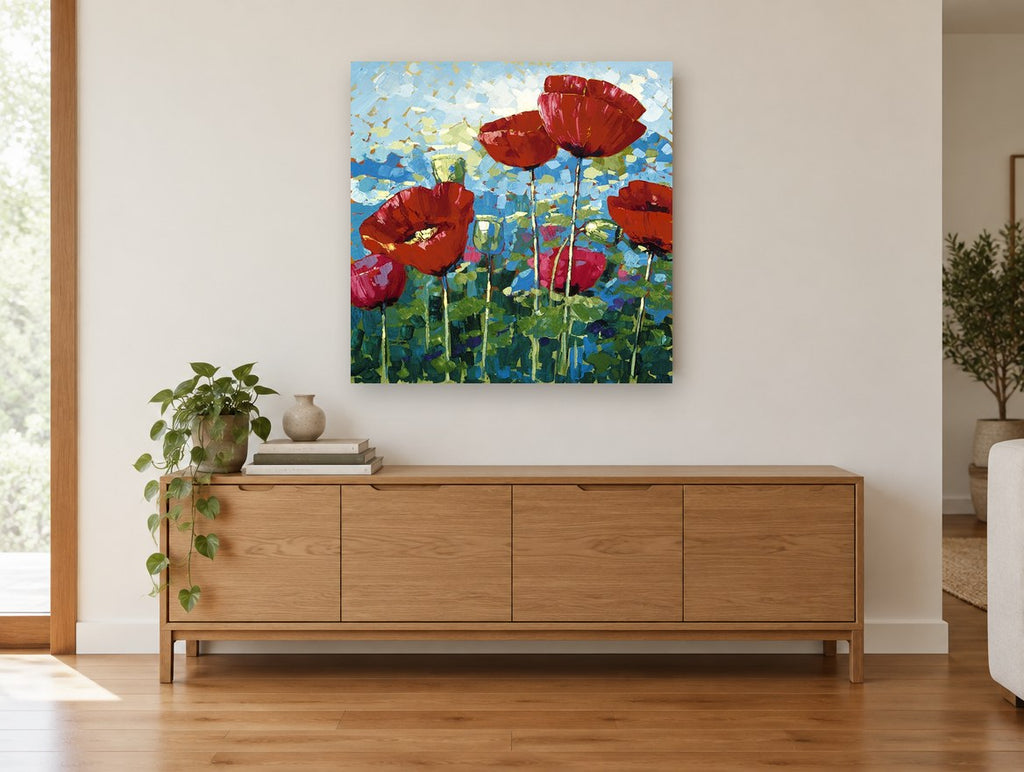 Poppies Against Blue Sky floral canvas print on the wall of a living room above a sideboard