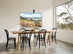 Lavender Hillside Farmhouse landscape canvas print on the wall of a dining room