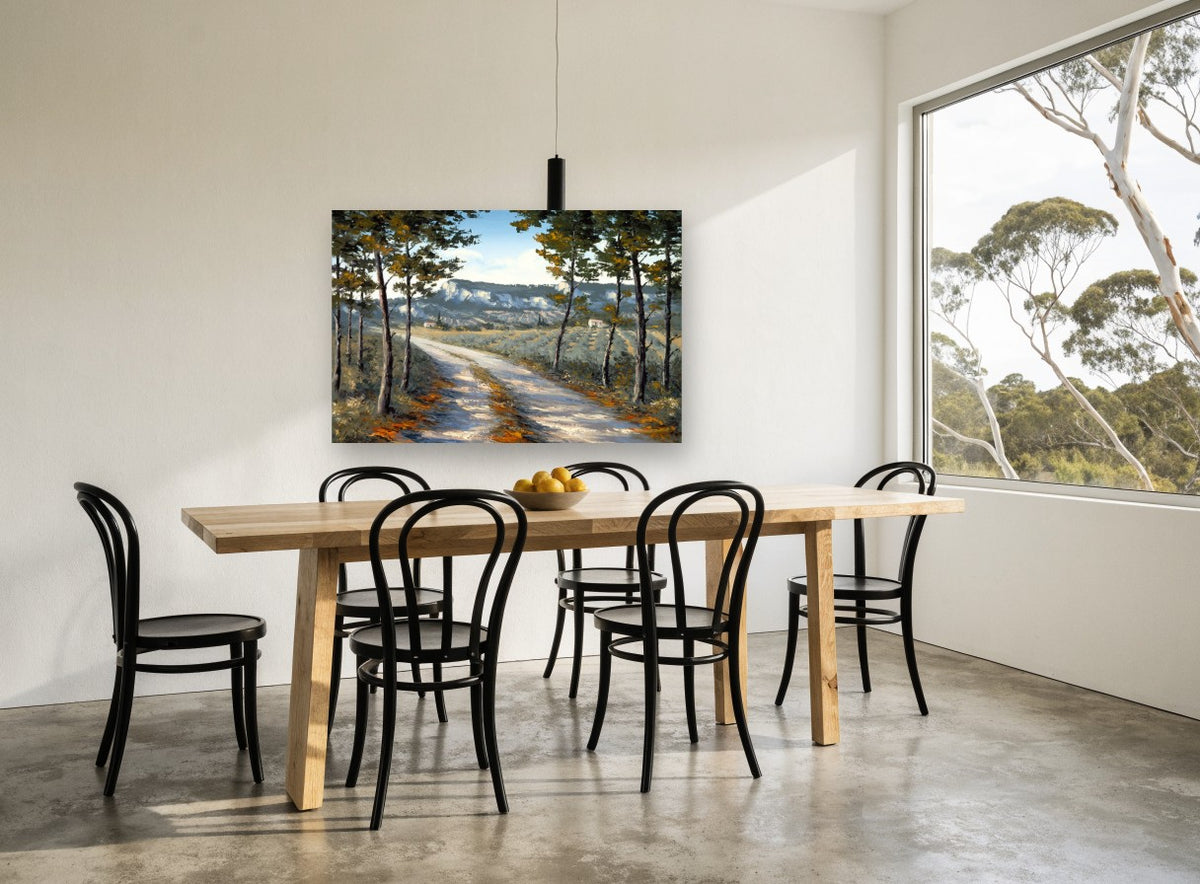 Sunlit Lane Through Pines landscape canvas print on the wall of a dining room