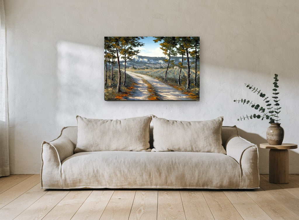 Sunlit Lane Through Pines landscape canvas print on the wall of a living room