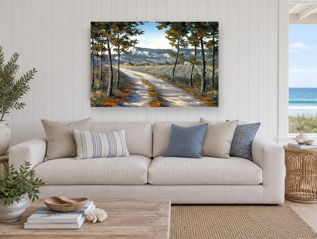 Sunlit Lane Through Pines landscape canvas print on the wall of a beach house living room